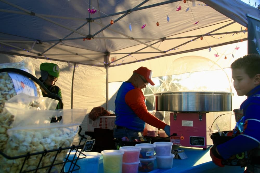 A booth serving candy and popcorn.