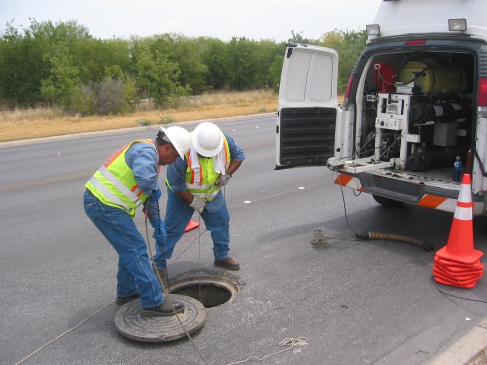 SAWS crews perform maintenance cleaning on a manhole.