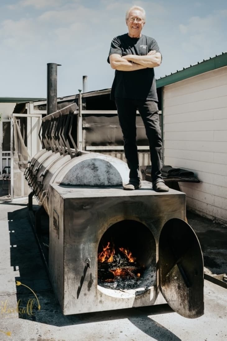 Terry Sullivan stands on barbecue pit