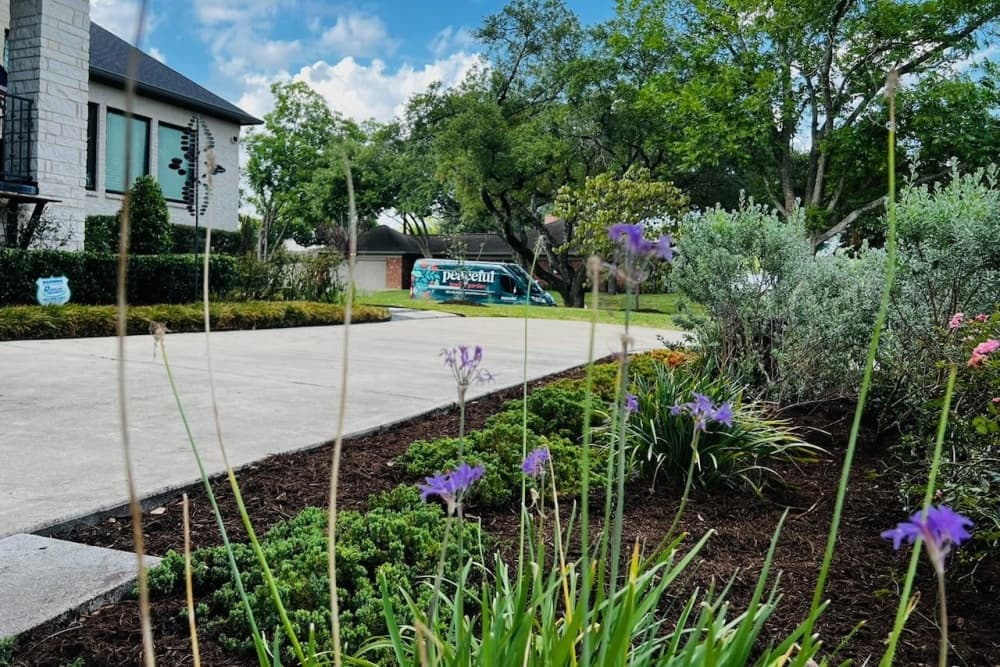 This is a photo of a home receiving landscaping. 