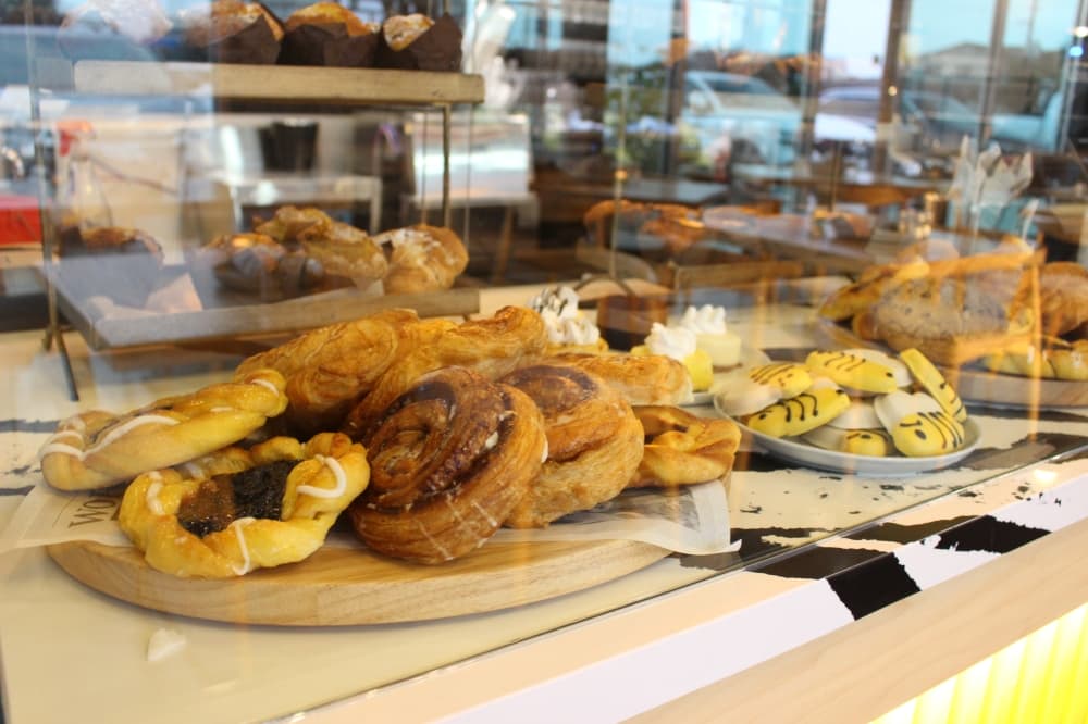 pastries on display behind glass