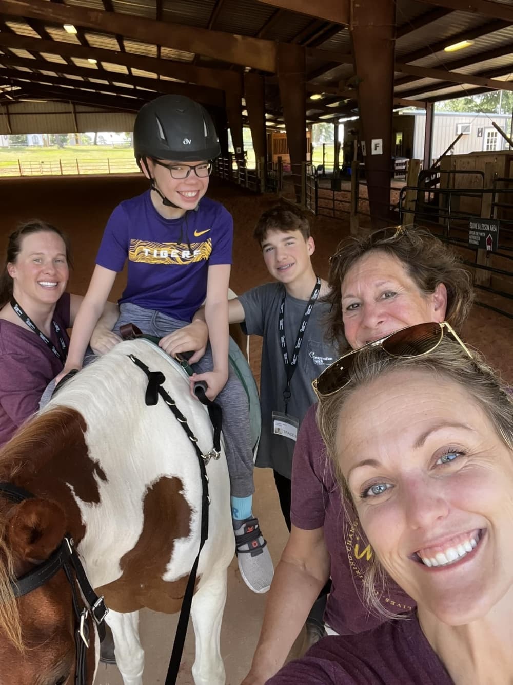 group of people with a horse