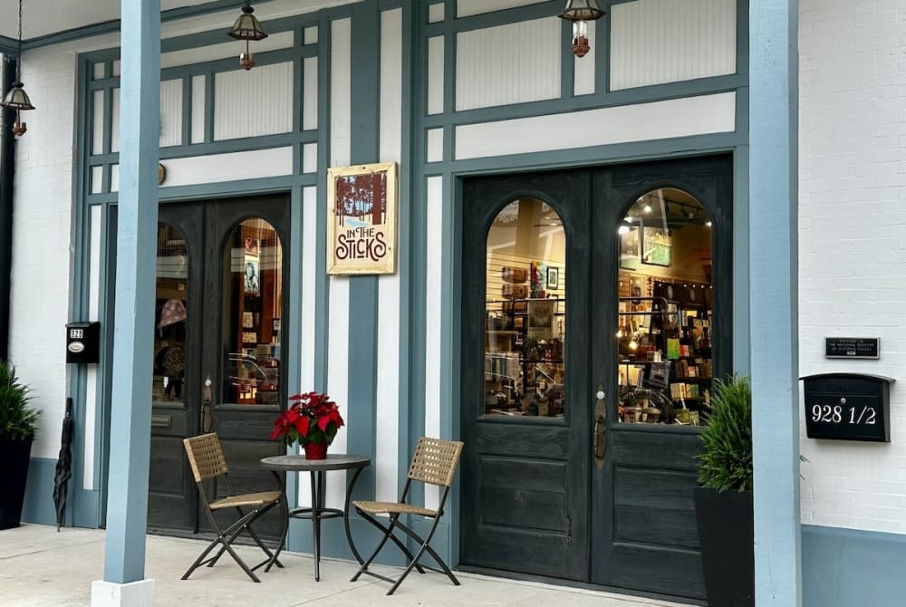 A photo of the outside of the store with blue and white accents.