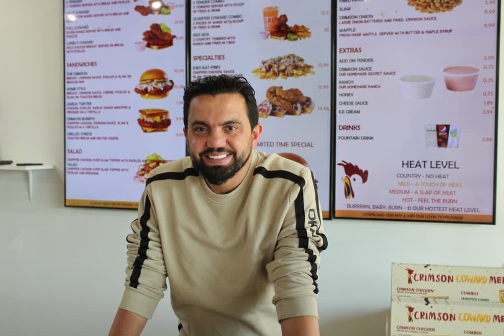 Hassan Bawab standing behind the counter. 