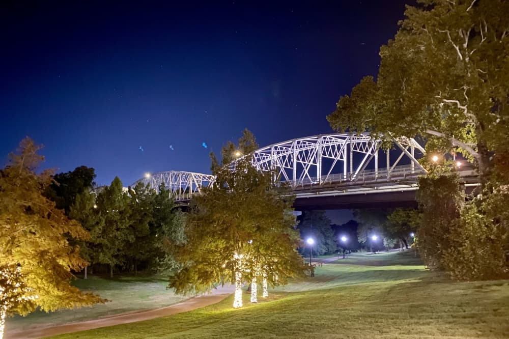 A bridge lit up by lights.