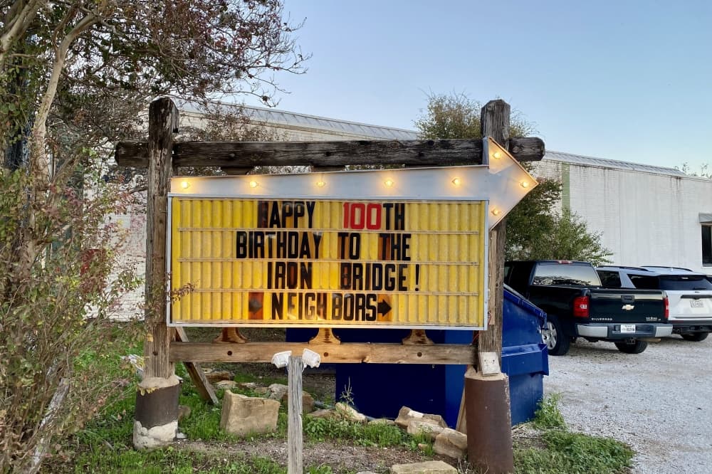 A sign for the Bastrop bridge event.