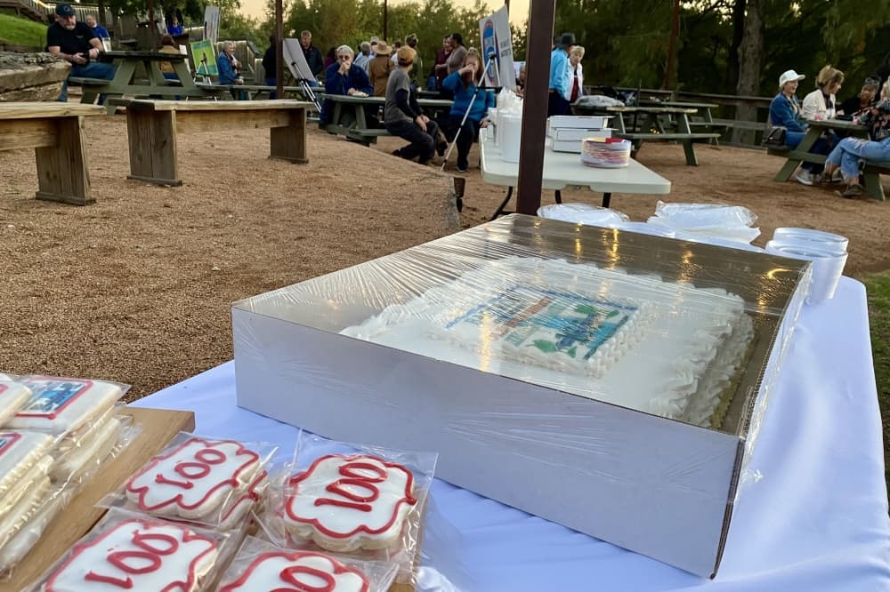 A cake on a table outside.