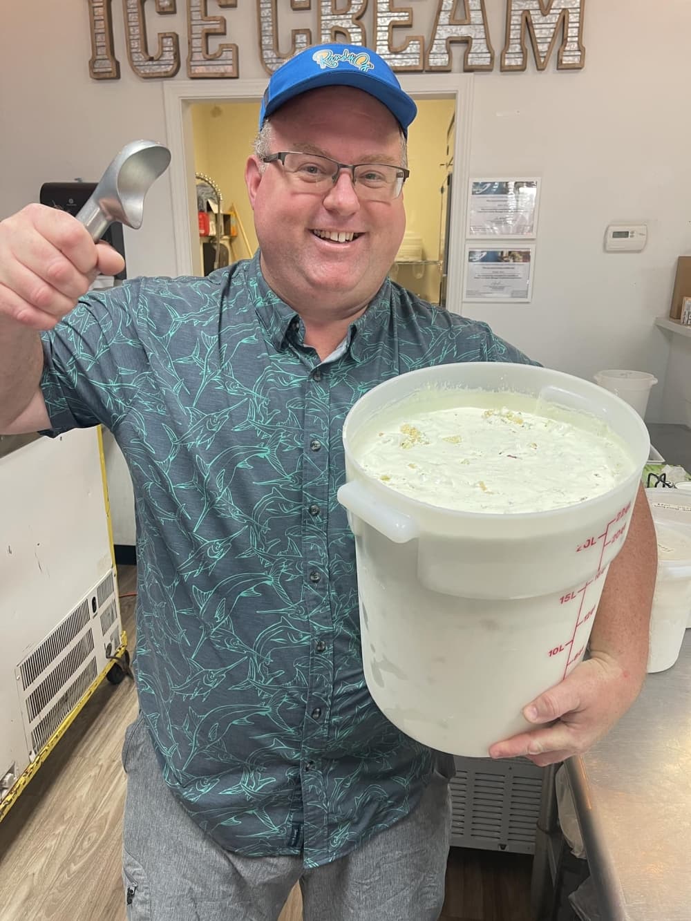 Owner Randy Gentry holding a bucket of ice cream. 