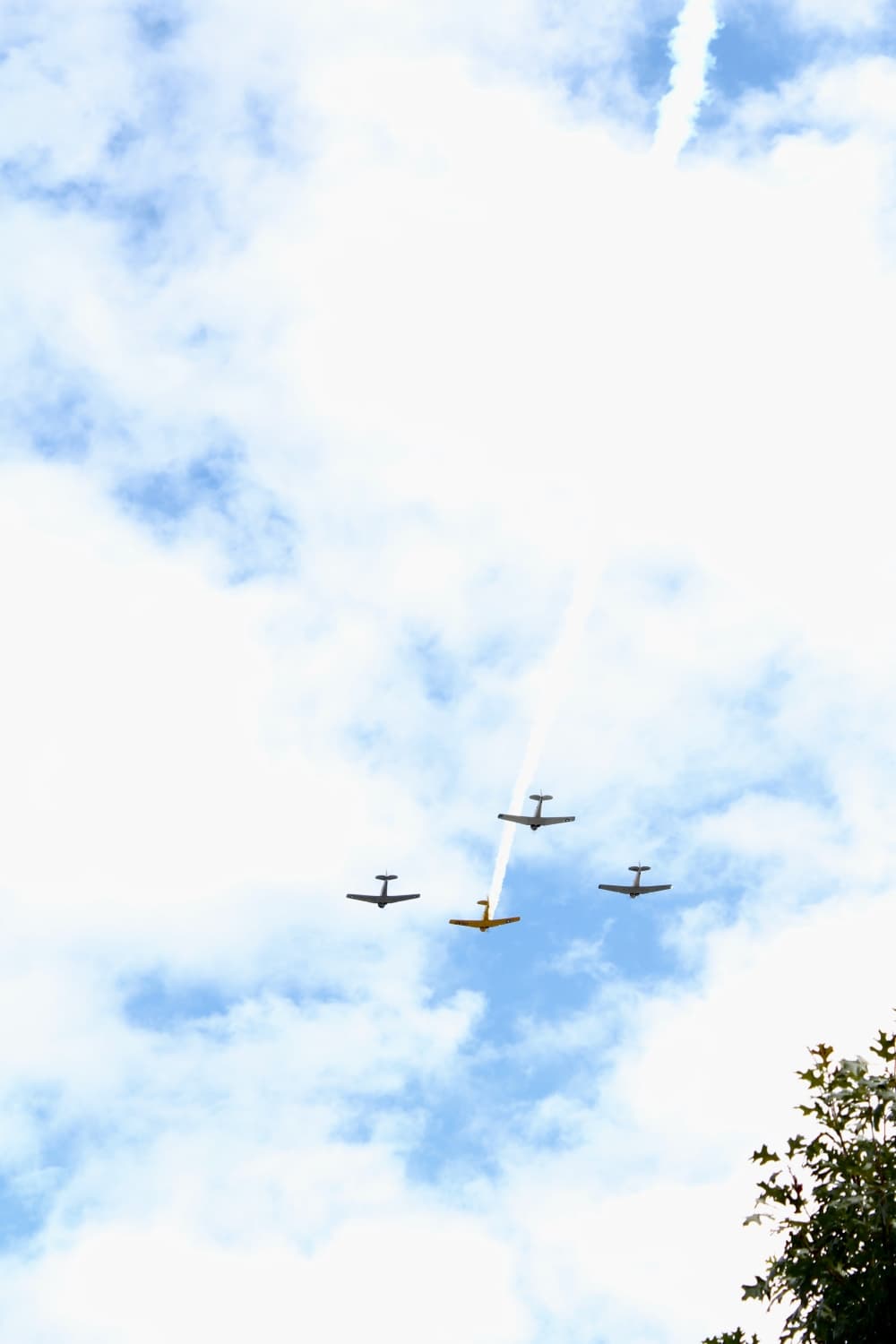 Four planes flying over