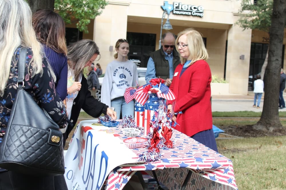 Women at a table with American flags
