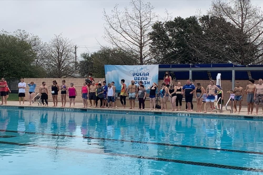 people jumping in a pool