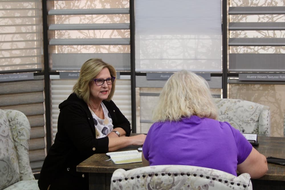 two women sitting at a table