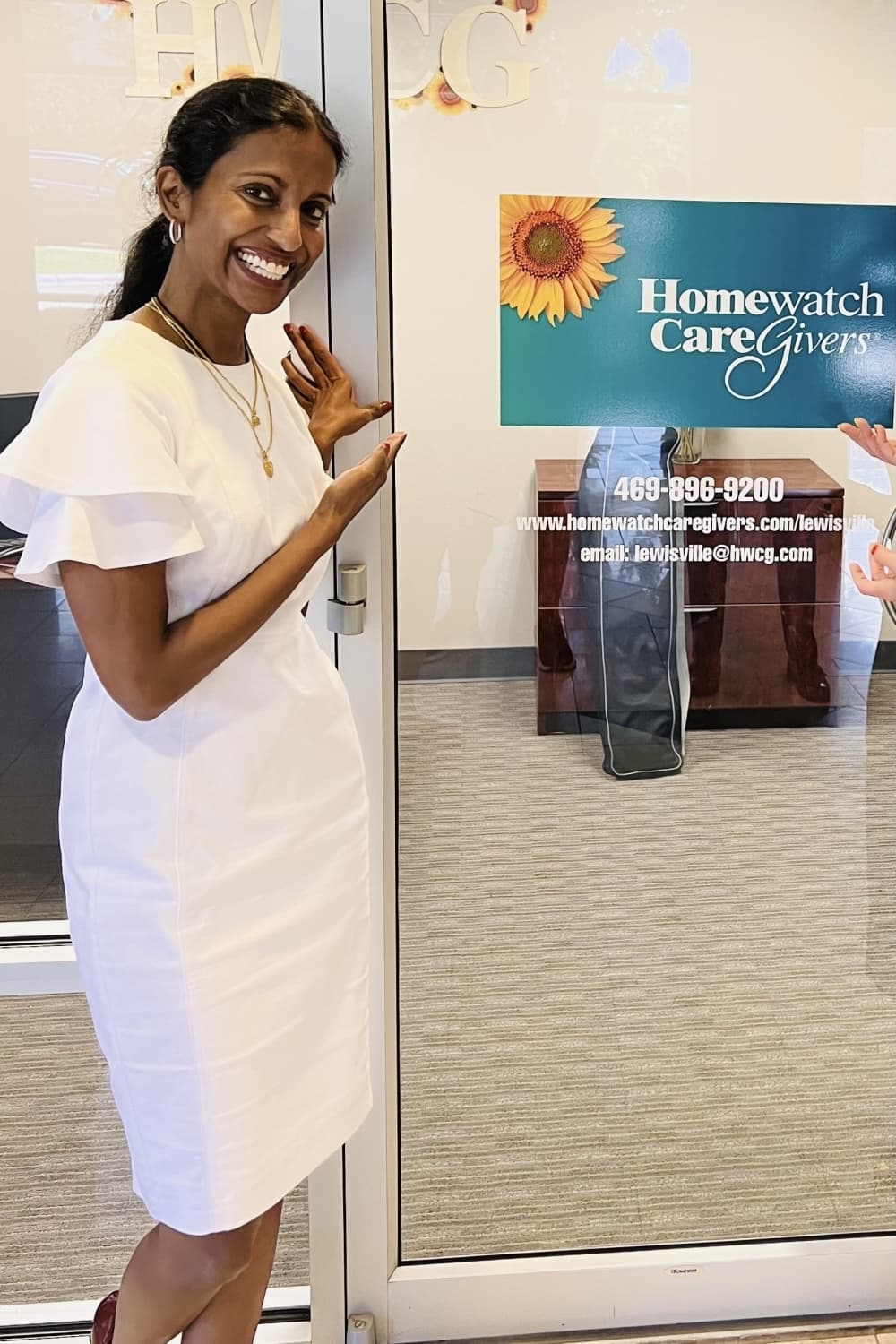 Jessie Nair posed outside of Homewatch Caregivers of Lewisville