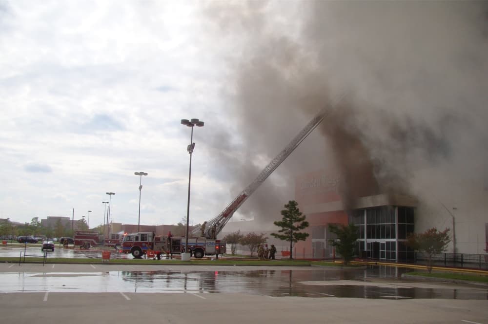 Firefighters battle a smoky fire