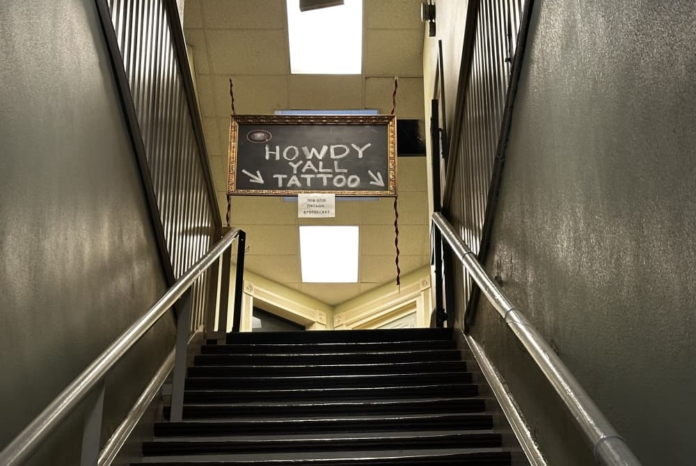 Looking up the staircase leading to the shop.