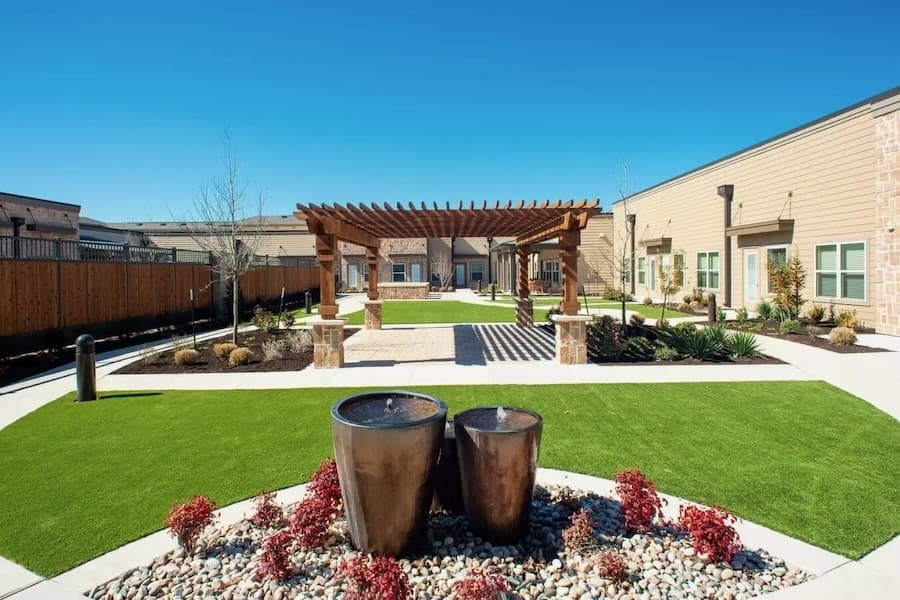 an outdoor area with a partially covered patio