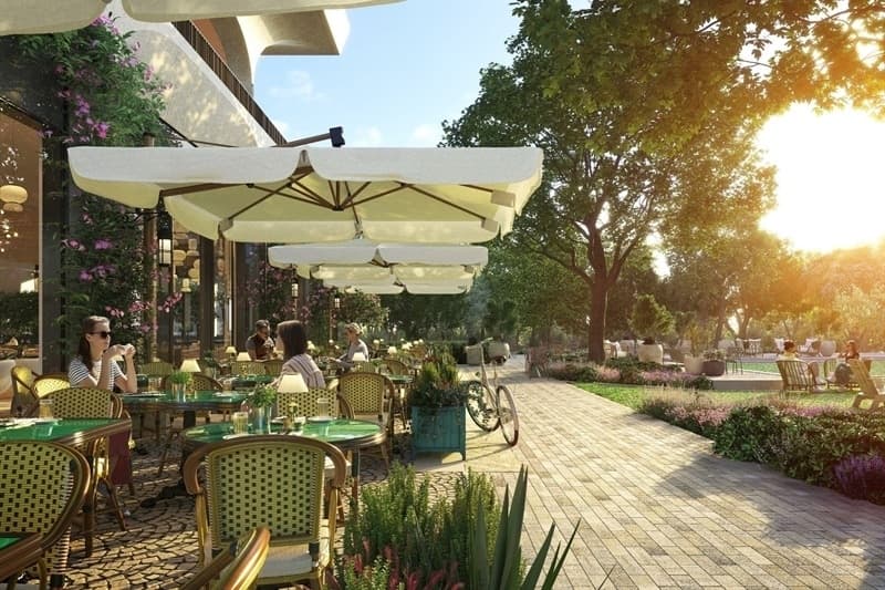 Rendering of people sitting at tables on a patio in a retail plaza. 