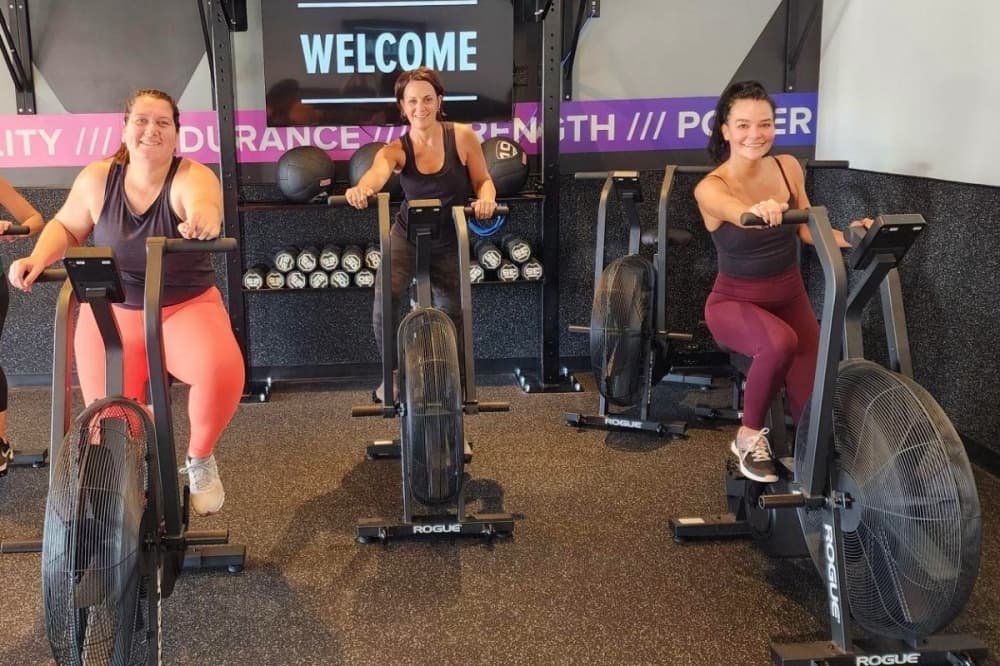 people on a stationary bike
