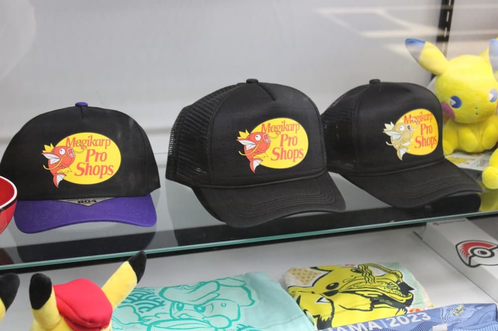 Pokemon hats in a display case.