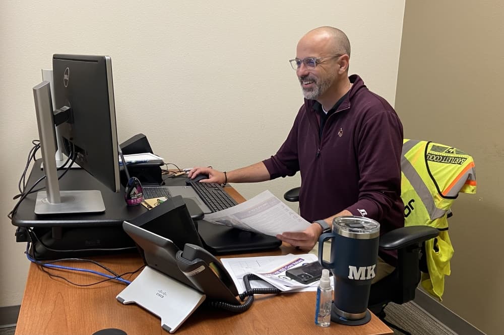 Legacy Ranch High School Principal Mark Koller working at his desk