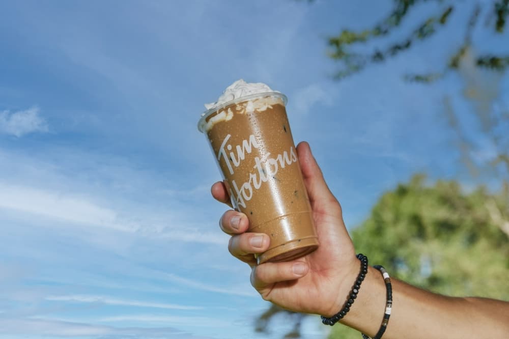 hand holding a tim hortons cup