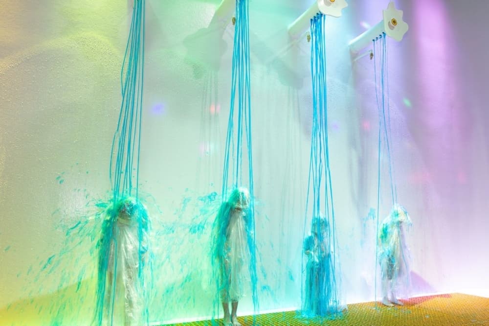 The Sloomoo Falls attraction lets guests get "slimed" wearing ponchos.