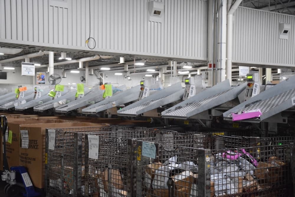 Machine sorting letters in a USPS processing and distribution center
