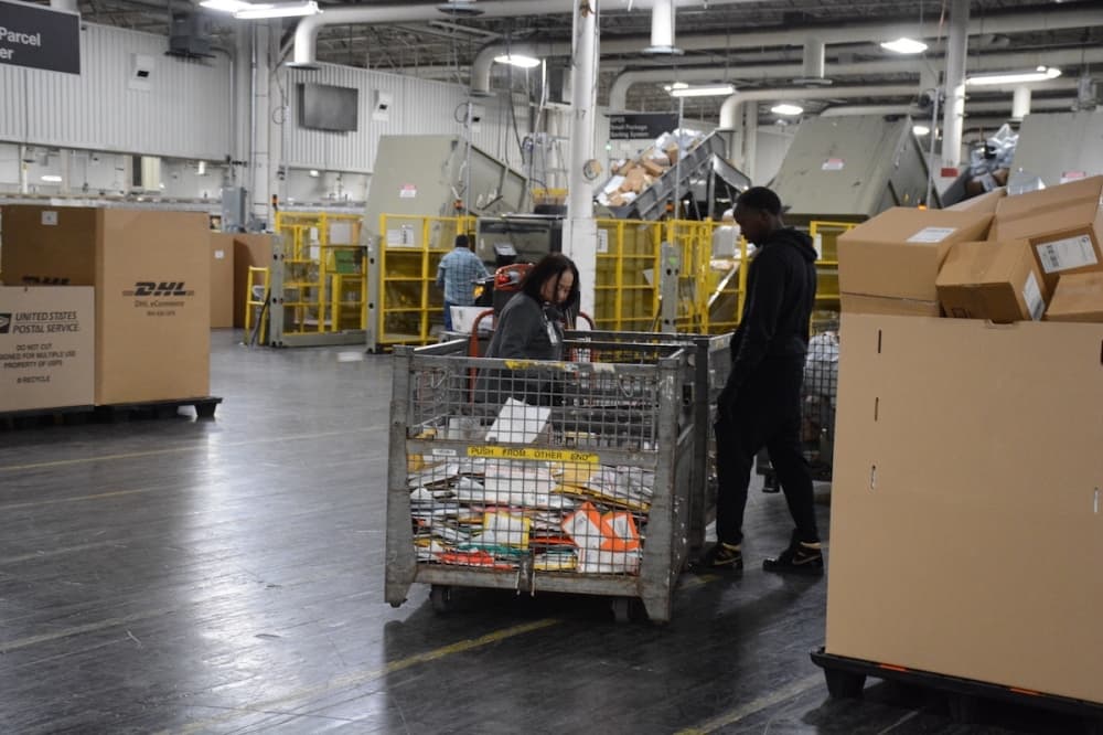 Workers over a group of sorted mail