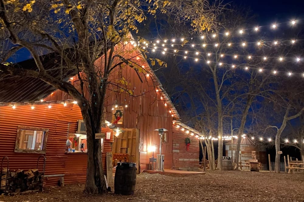 Red barn with string lights