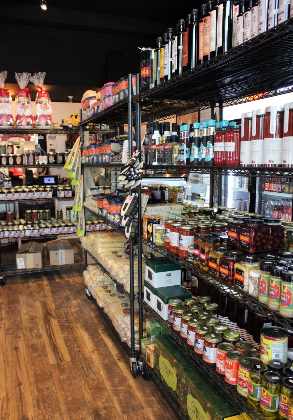 A variety of market items, such as salsa, pasta, sauce, pickles and more, are sold here. (Karen Chaney/Community Impact)