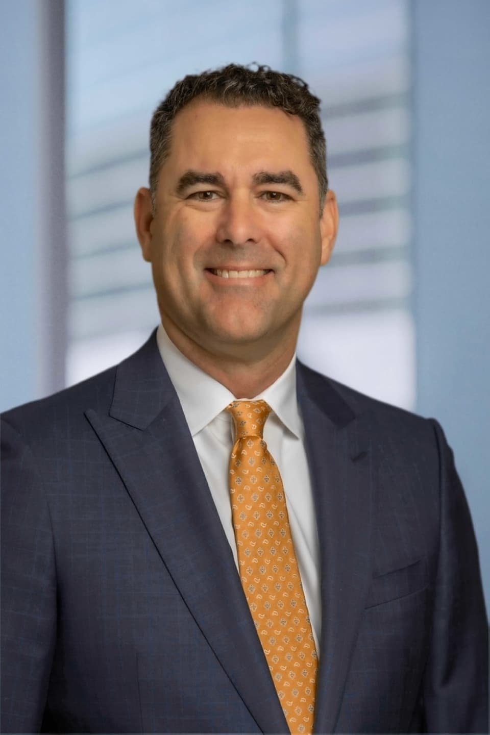 Headshot of a man in a suit