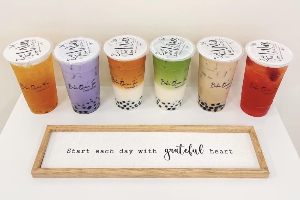 A variety of boba drinks lined up 
