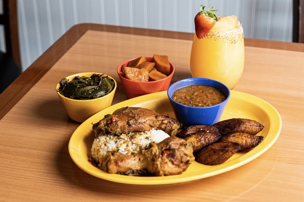 Chicken, white rice and plantain in a plate 