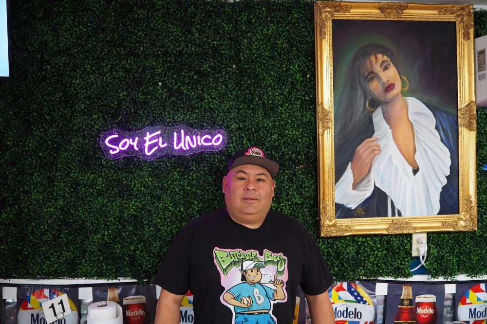 butcher boy taco house owner stands inside of the restaurant