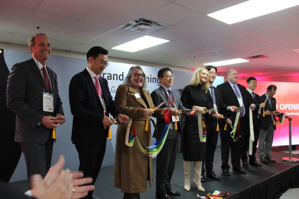 Several public and private officials cut a ribbon at LG Electronics' new factory in Fort Worth. 