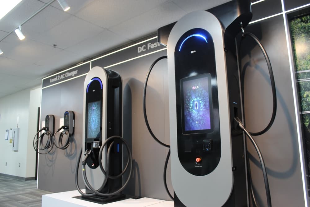 LG Electronics' electric vehicle charger prototypes lined up against a wall. 