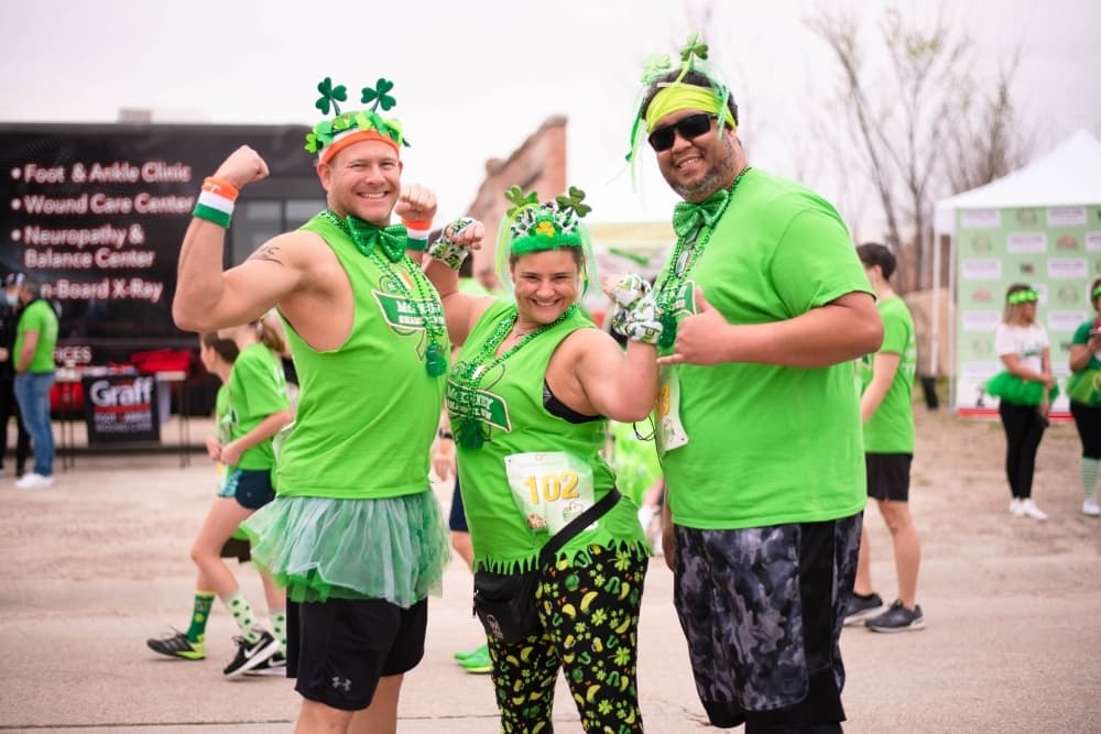 Runners at a race wearing green