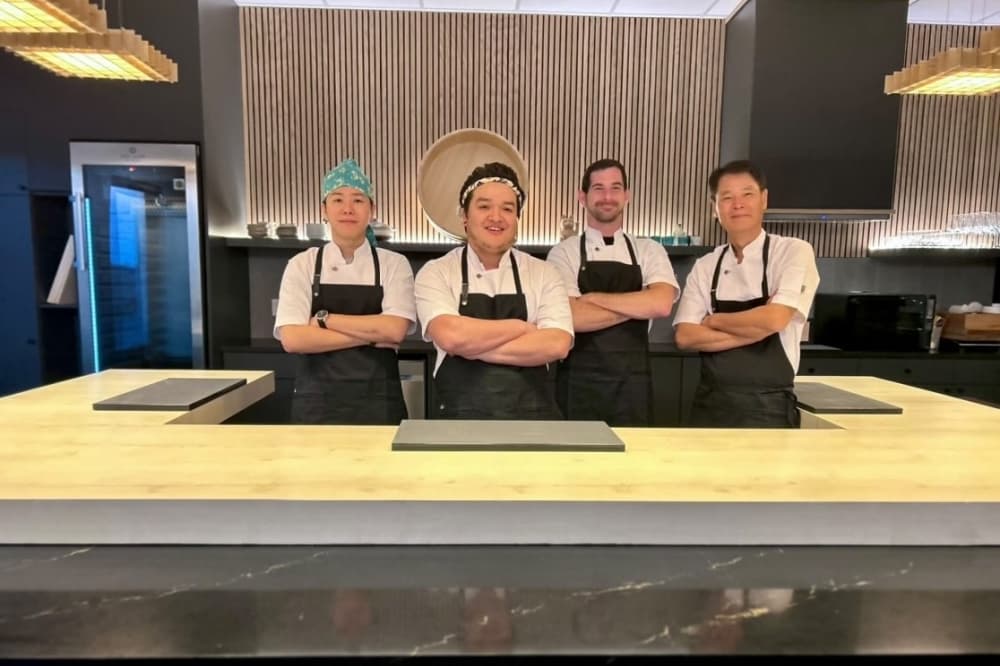 Four chefs pose in the kitchen at Tare.