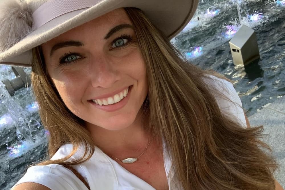 Amanda Gruetzner poses for a selfie outside.
