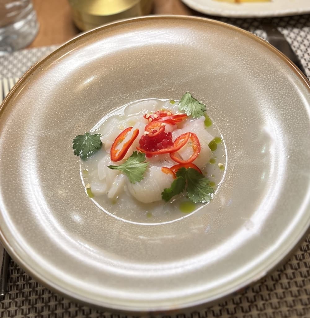 A scallop dish on a plate