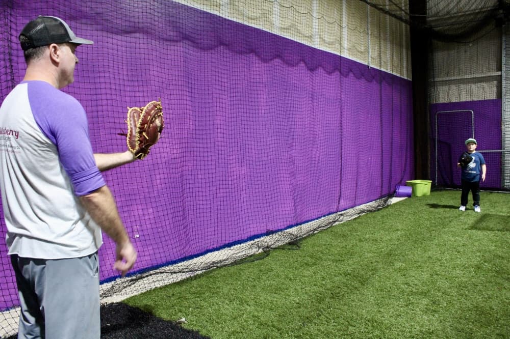  Jim Squires and kid during a baseball lesson