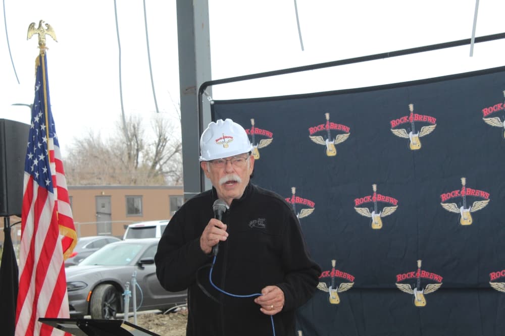 The Grapevine mayor speaks in front of Rock & Brews background