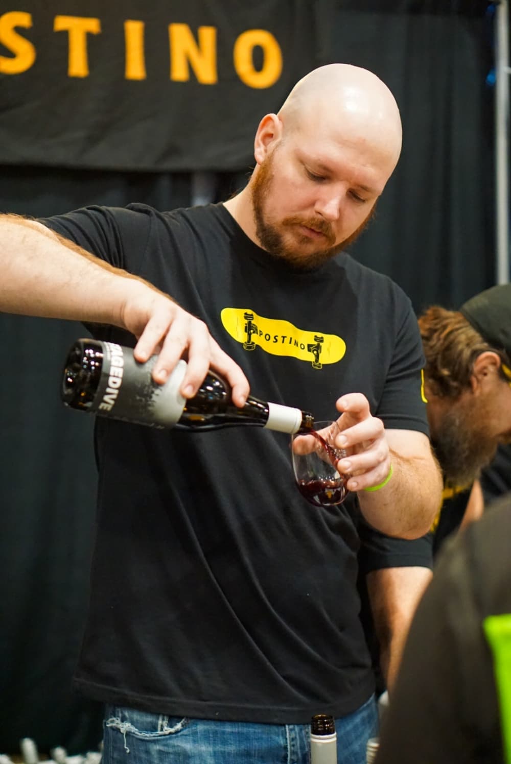 A man pours a drink