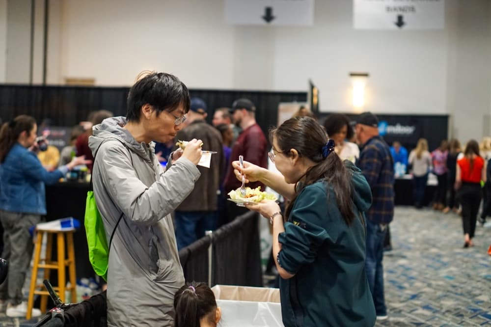 Two people sample foods 