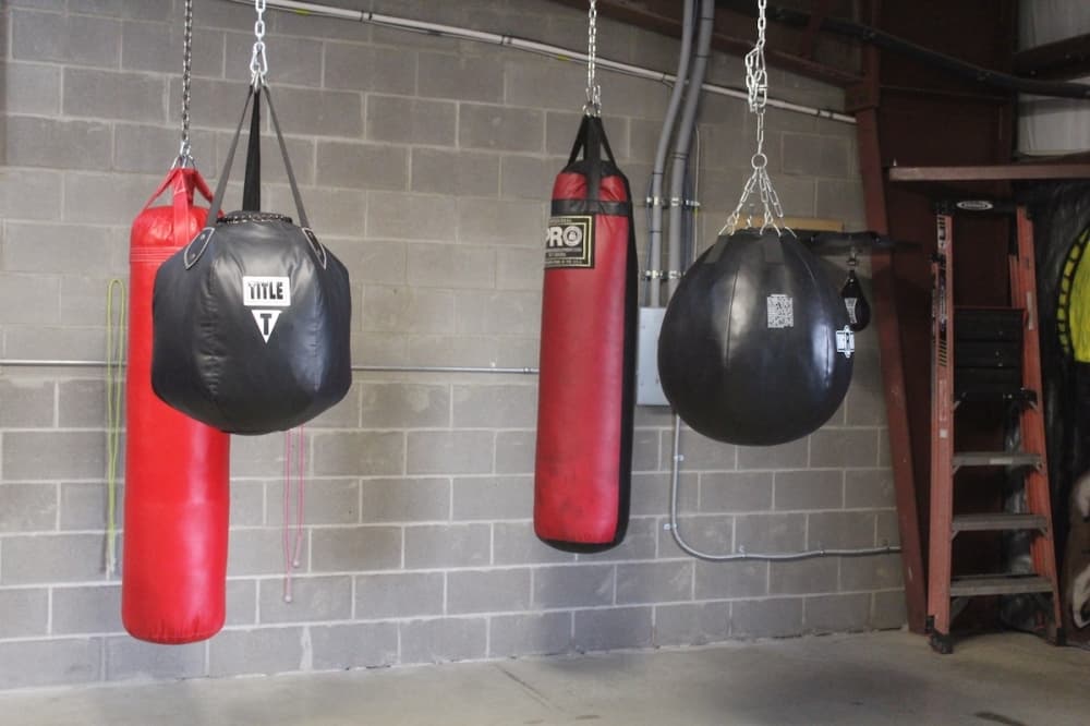 The boxing gym has heavy bags for boxers to hit. (Amira Van Leeuwen/Community Impact)