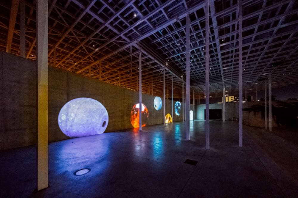 Artifacts are projected onto the walls.