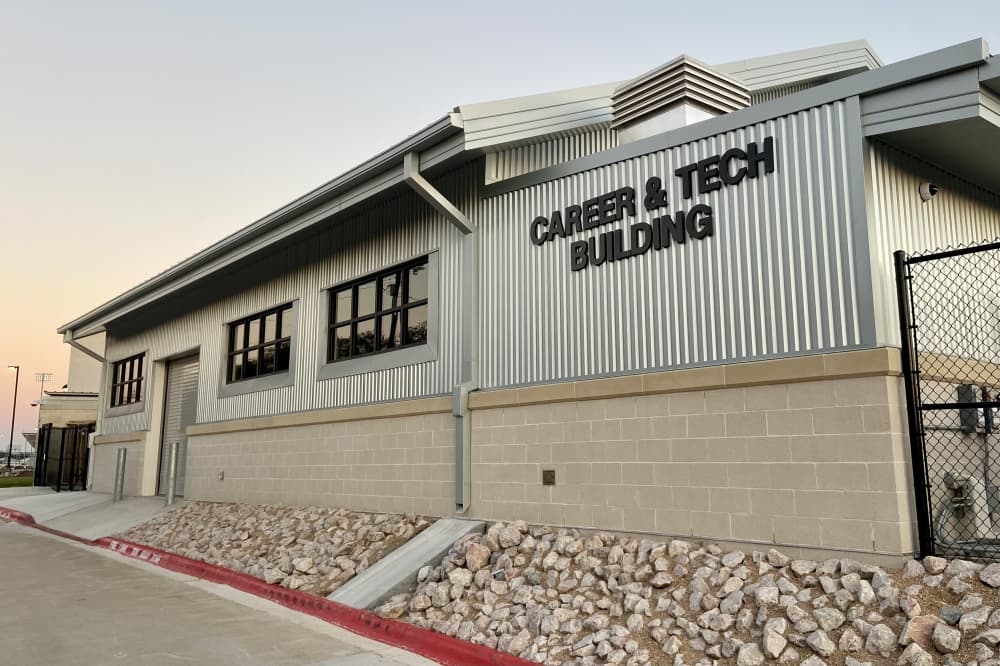 A metal building that reads "Career & Tech Building"