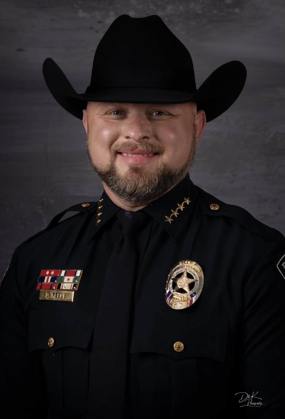 The photo is a headshot of Danny Keele.