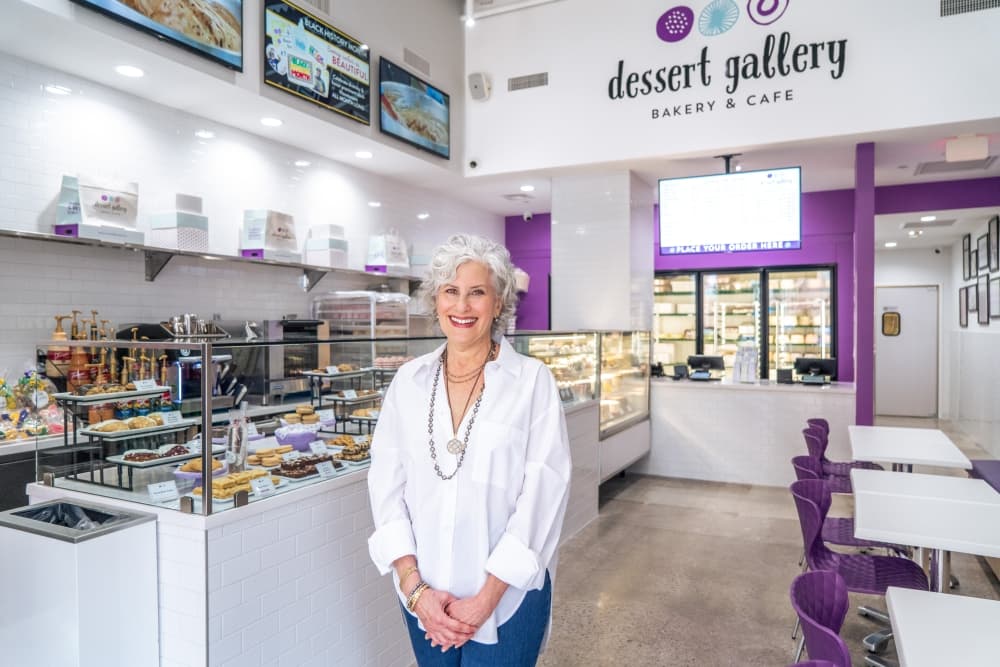 Bakery owner standing inside cafe