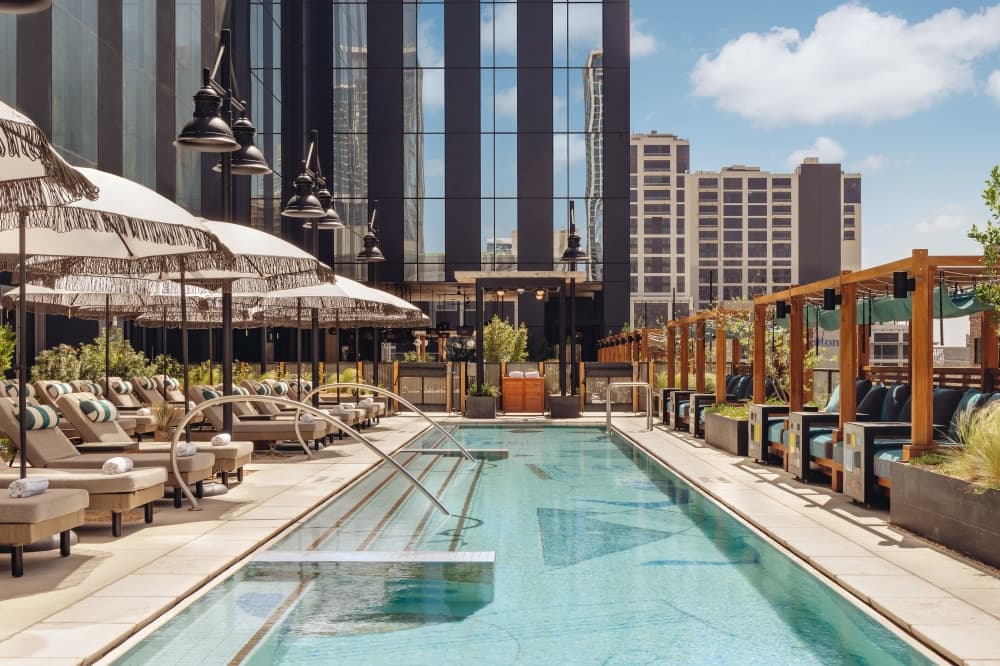 A look at the rooftop deck, with the pool in the center and cabanas on either side.